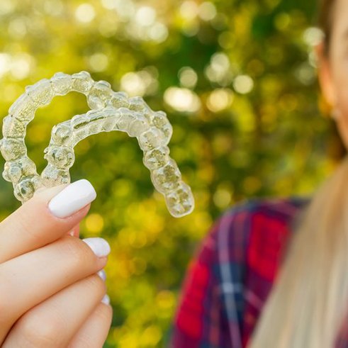 Lady shows off her clear aligners