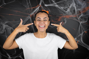 an Invisalign patient smiling during Halloween